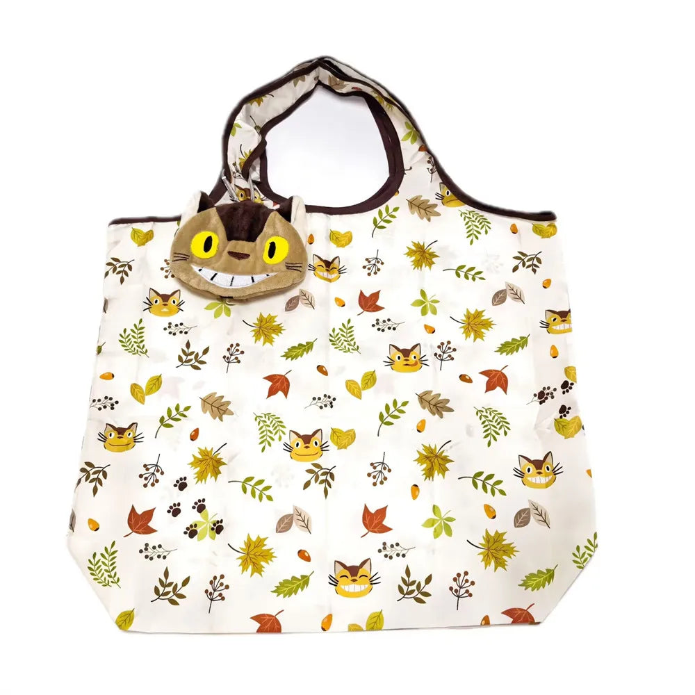 A white fabric tote bag featuring a cute yellow and brown hippo face design.