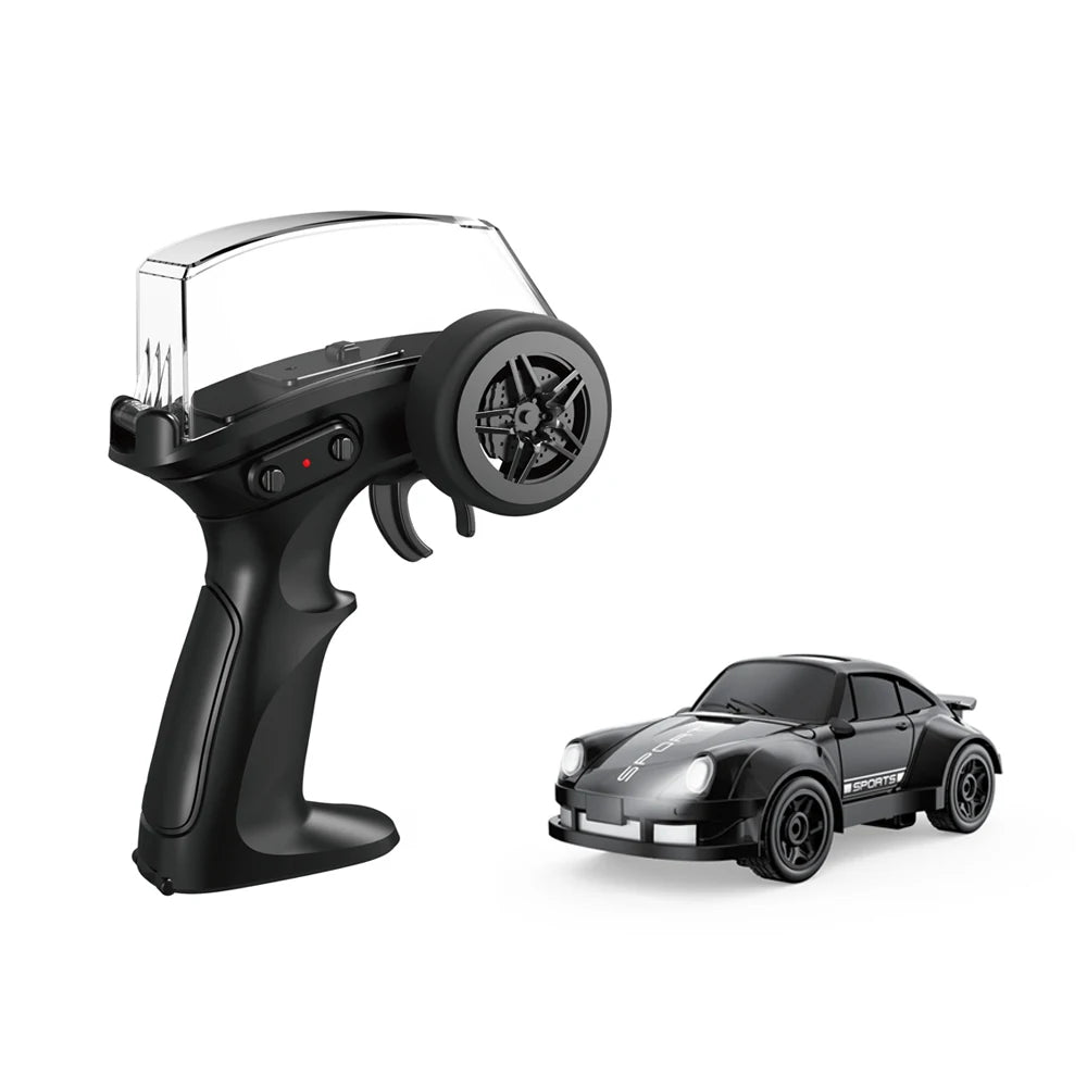 A black mini 4WD stunt car is shown next to its 2.4G remote control and battery pack.