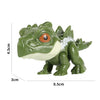 A green finger dinosaur fidget toy with movable joints and an orange eye.