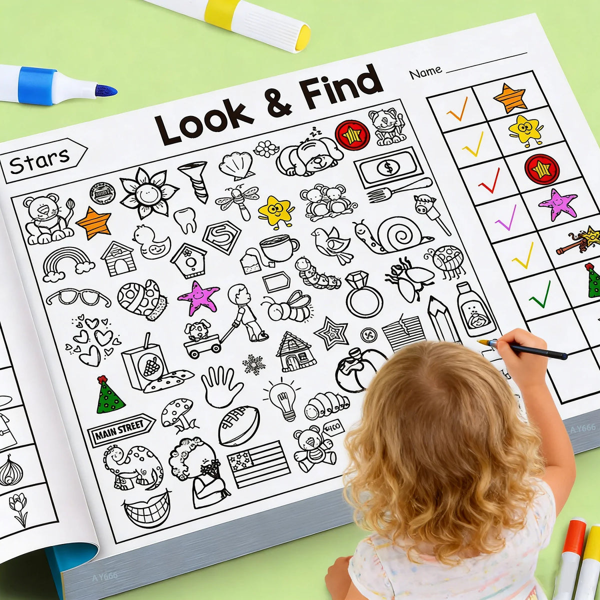 A toddler is coloring in a Look & Find activity book featuring various stars and objects.