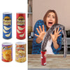 A person is holding a can of Spring Snake Prank Chips in a realistic snake shape against a wooden table.