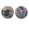 A pair of round silicone beads featuring floral and animal patterns in black, white, yellow, pink, and blue tones.