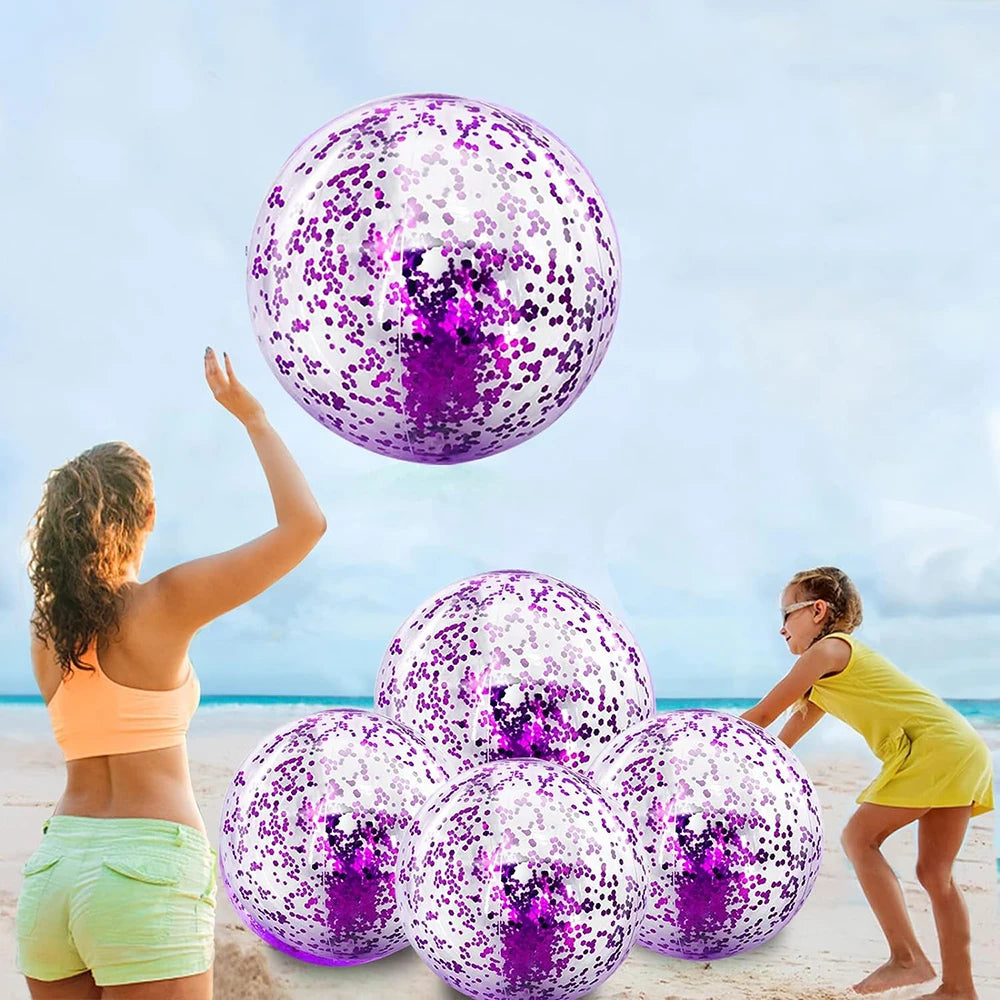 A woman is holding a purple sequined inflatable beach ball against a bright blue sky and ocean backdrop.