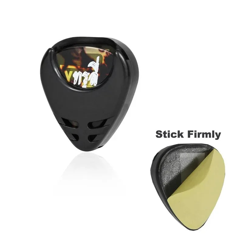 A black guitar pick holder with a clear window displaying a guitar pick.