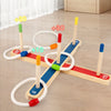 A wooden ring toss game with colored wooden pegs and rings, showing various scoring options like +10, +20, +30, and 15.