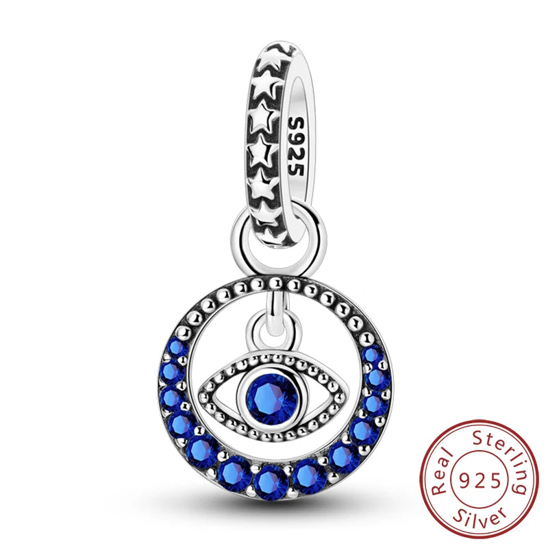 Sterling silver charm beads set featuring a cross, angel, and evil eye designs for DIY jewelry making