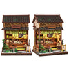 A detailed 3D wooden book nook kit featuring traditional architecture and LED lighting.