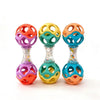 Three colorful soft rubber teething and grasping rattle toys in pink, green, and orange.