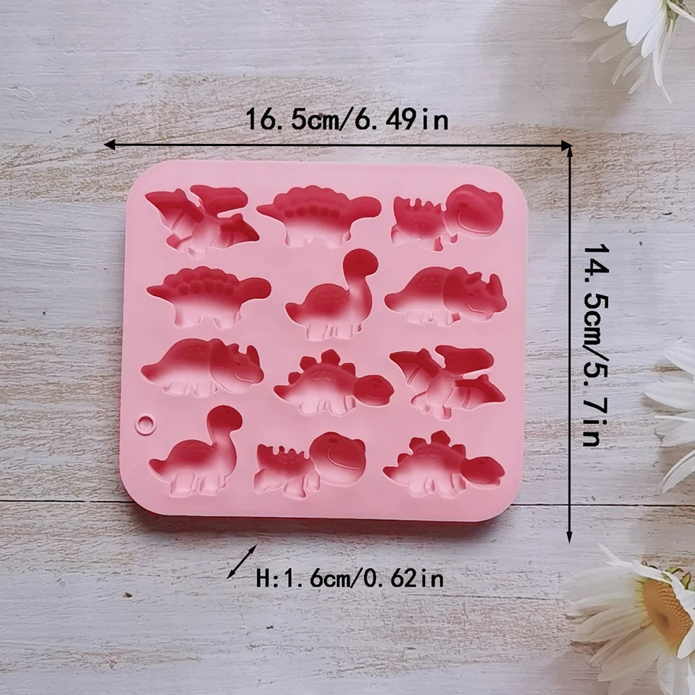 Pink silicone mold with various dinosaur shapes for baking and craft projects