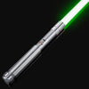 A silver lightsaber with a bright green blade is shown diagonally against a black background.