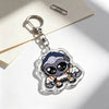 A clear acrylic keychain charm featuring an anime-inspired character with blue skin and headphones, attached to a silver keyr
