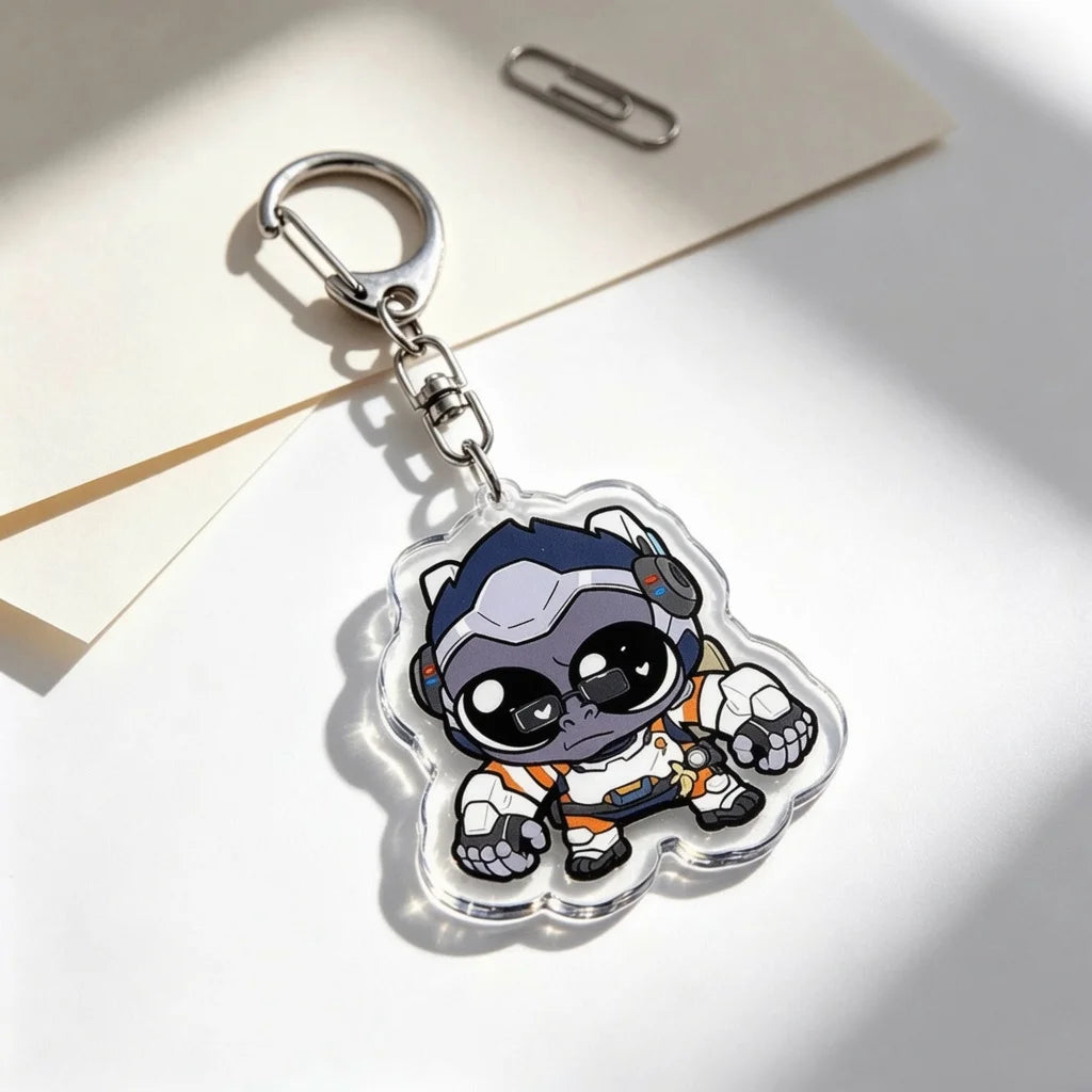 A clear acrylic keychain charm featuring an anime-inspired character with blue skin and headphones, attached to a silver keyr