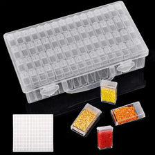 Clear plastic storage box for diamond painting beads with a portable handle and loose beads displayed below