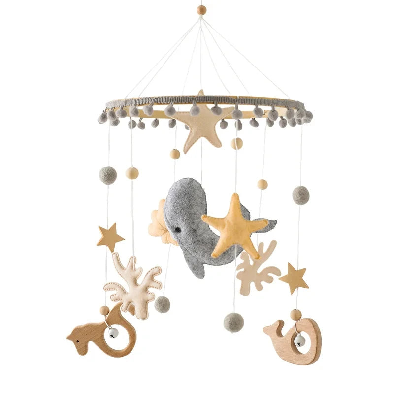 Wooden felt forest animal crib mobile featuring various wooden and felt animals hanging from a circular wooden ring
