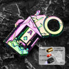A pink and green alloy fidget toy gun with a circular lens and various components for target shooting.