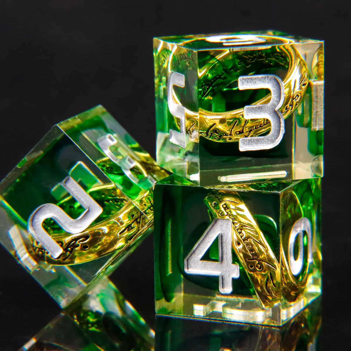 A set of green liquid core resin dice showing the numbers 3 and 4, reflecting on a dark surface.