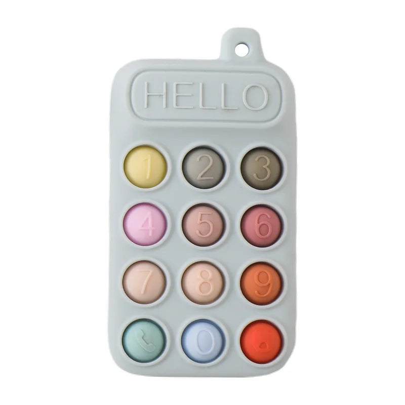 A white silicone baby teether toy with numbered silicone fingers and a cartoon car design.