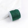 A roll of dark green 0.8mm cotton nylon macrame cord for jewelry making and crafts.