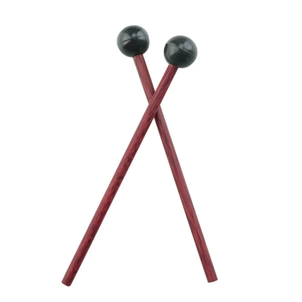 A pair of wooden handpan drum mallets with black silicone tips.