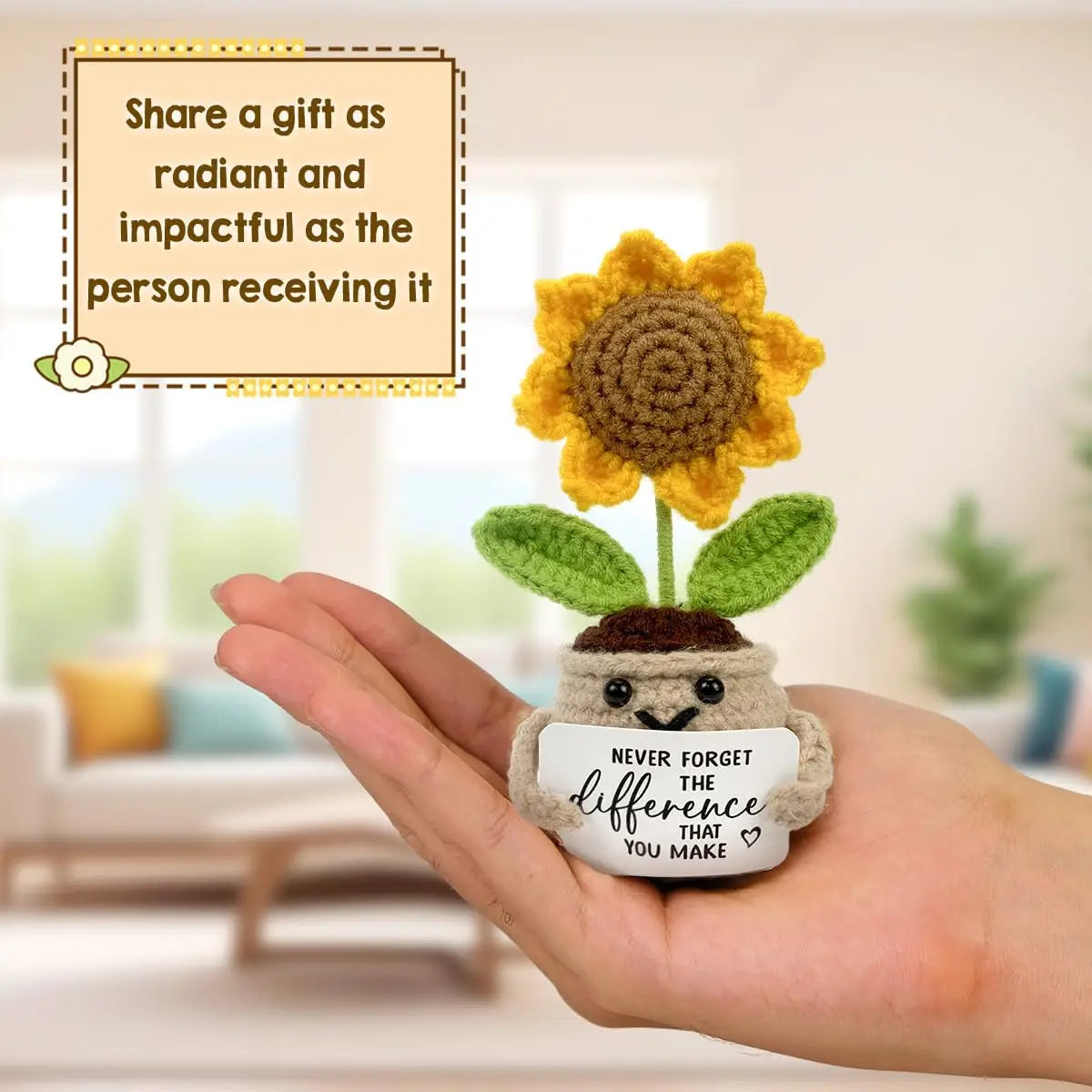 A hand holds a handmade crochet sunflower pot doll with a message about making a difference.