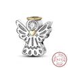 A sterling silver charm featuring an angel design with a heart and a clear stone, set against a white background.