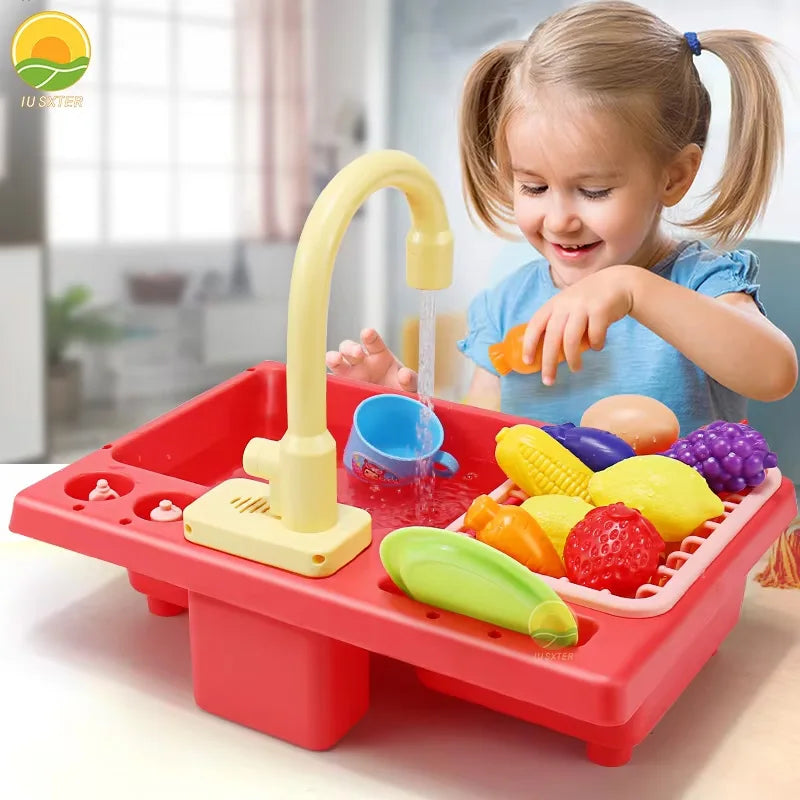 A child is playing with a red plastic kitchen sink toy that features running water and play food.