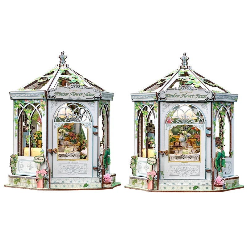 A detailed 3D wooden book nook kit featuring an antique-style house with arched windows and greenery.