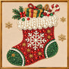A detailed diamond painting of a festive Christmas stocking featuring red, green, and white elements.