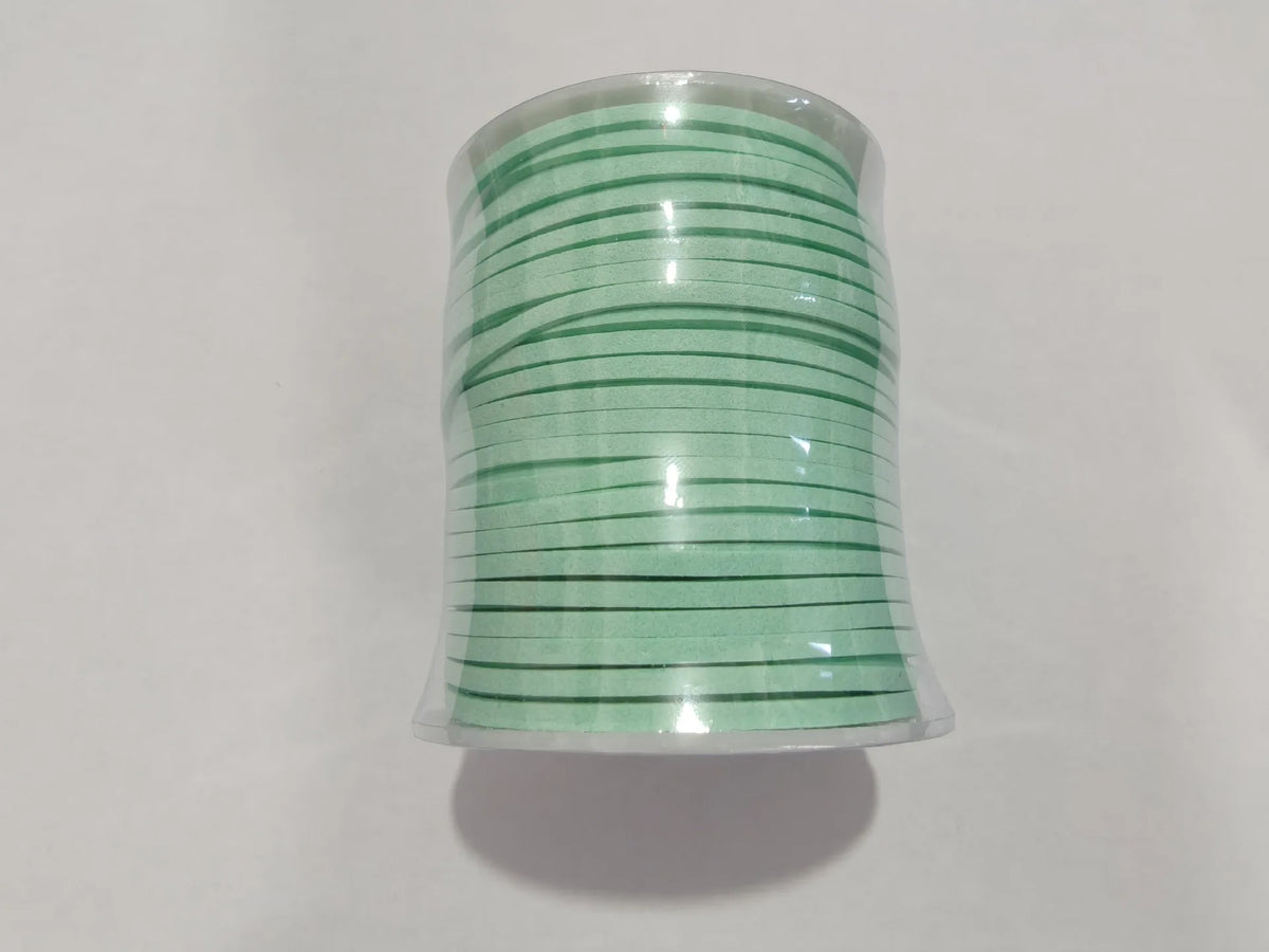 A roll of green velvet faux suede braided ribbon used for crafting and gift wrapping.