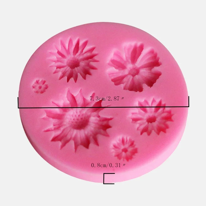 A pink silicone mold with seven flower shapes for decorating fondant, cake, and chocolate.