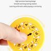 A hand is spinning a yellow math fidget spinner with numbered orange components.