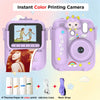 A pink instant color printing camera with a screen, a lens, and accessories like thermal paper and a neck strap.