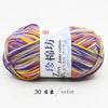 A ball of multi-colored jute yarn labeled as Jane cotton yarn for knitting and crochet