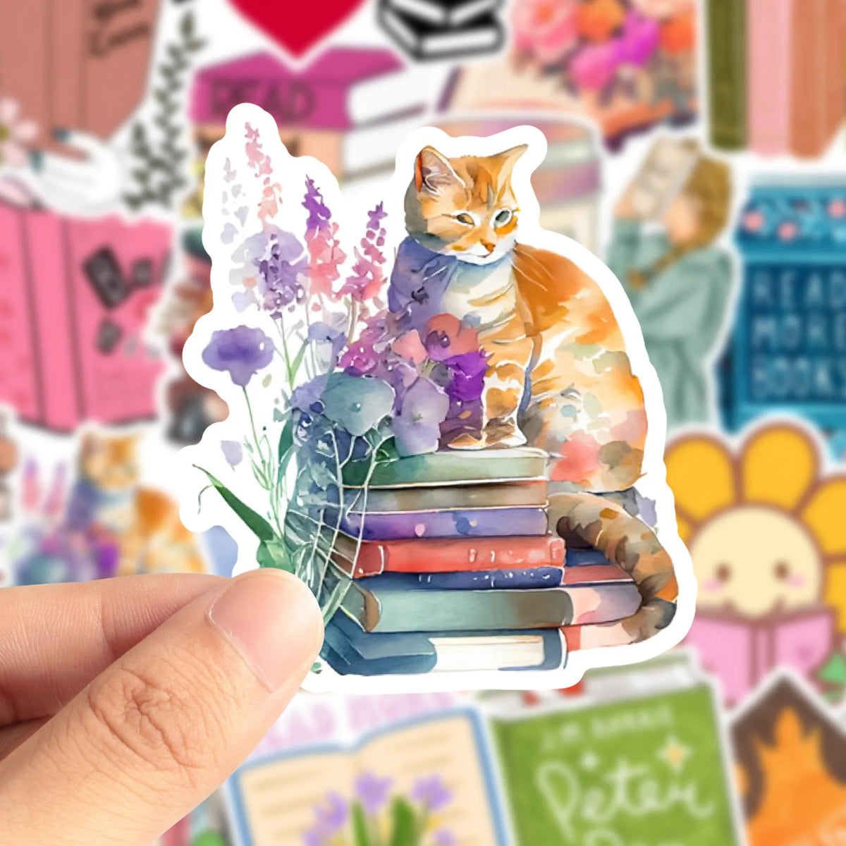 A sticker featuring an orange cat sitting on a stack of colorful books with floral accents.