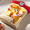 A yellow animal slide puzzle with a red watch component is shown on a white surface.