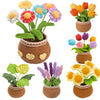 A collection of crocheted potted plants in various colors and textures, including flowers and leaves.