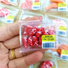A hand holds a clear plastic package of beef rolls with a barcode, labeled 1.3kg for $3.99.