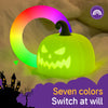 A glowing lime green pumpkin LED night light is shown against a soft background with a rainbow light effect and a silhouette 