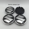 Four 56mm Suzuki wheel cap components shown, including a flat cap and a raised center cap.