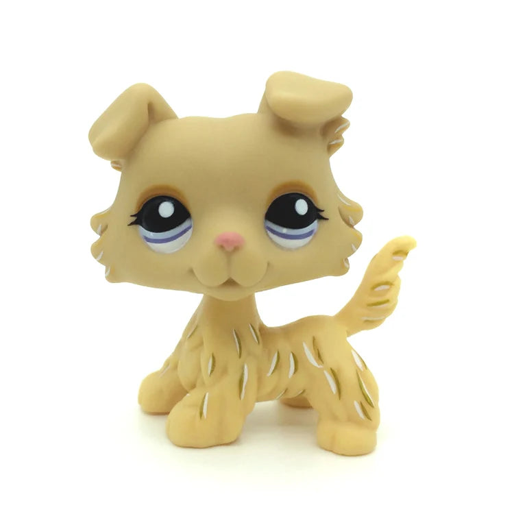 A small, light tan Littlest Pet Shop style standing dog figure with large eyes and floppy ears.
