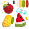 Crocheted fruit items including a red apple, yellow lemon, and watermelon slices.