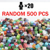 A large pile of random magnetic building tiles in various colors and shapes for a STEM toy set.