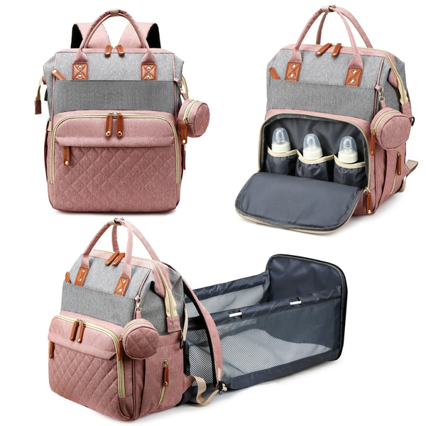 A pink and gray all-in-one diaper backpack with a built-in changing station and storage pockets.