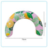 Pink inflatable U-shaped swim ring with a tropical leaf and citrus pattern.