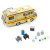 A yellow Breaking Bad RV model kit made of building blocks with ladders and windows.