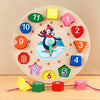 A wooden sorting clock with numbers and shapes, including a penguin figure, arranged in a circle.