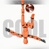 An orange magnetic multi-jointed action figure is displayed against a gray background.