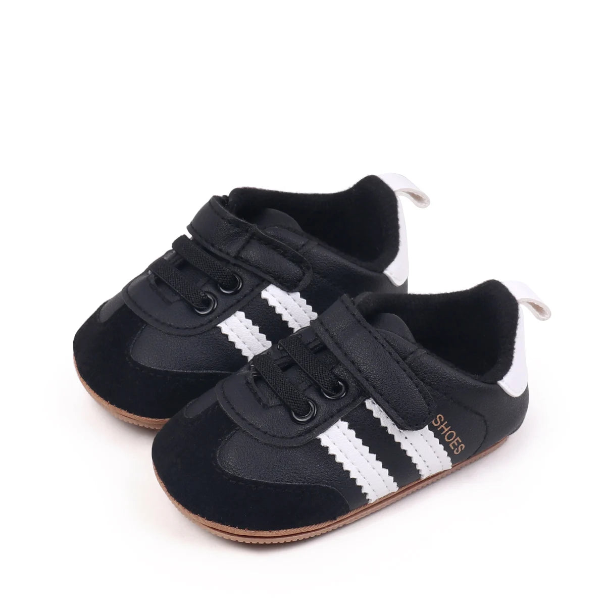 A pair of black baby first walkers shoes with white stripes and soft lining.