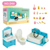 A miniature dollhouse bathroom playset featuring a toilet, sink, and various accessories.