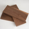 A stack of handcrafted black walnut wood boards for engraving and DIY projects.